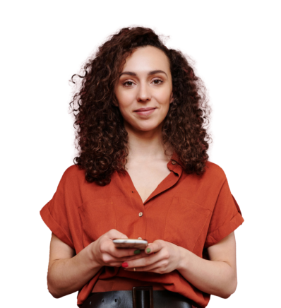 Woman holding phone and smiling at camera